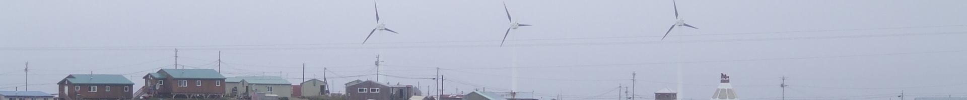 Hooper Bay, Alaska with wind turbines and homes in the background